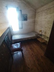 a room with a bed and a table and a window at Playa Verde Casa a 150 metros de la playa in Playa Verde +14 photos