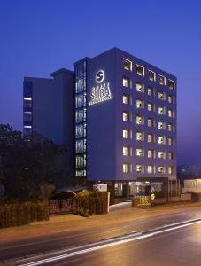 a hotel with a sign on the side of a building at Hotel Suba International in Mumbai