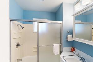 a bathroom with a shower and a toilet and a sink at La Bella Vita in Cannon Beach +13 photos