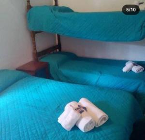 Ένα ή περισσότερα κρεβάτια σε δωμάτιο στο Hosteria sol naciente +1 φωτογραφίες