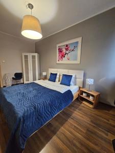 Posteľ alebo postele v izbe v ubytovaní Quiet Apartments Kościelna