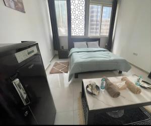 Postel nebo postele na pokoji v ubytování Corniche Street - New Suave Room
