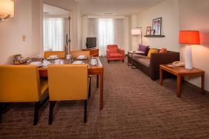 a living room with a dining table and a couch at Residence Inn Alexandria Old Town/Duke Street in Alexandria