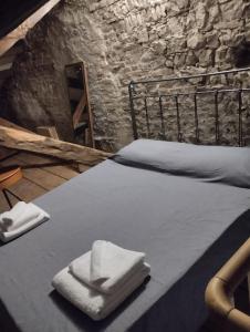 Ένα ή περισσότερα κρεβάτια σε δωμάτιο στο Domus terme romane