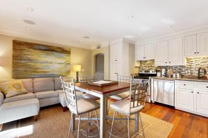 a kitchen and living room with a table and a couch at Mariner's Watch 4236 in Kiawah Island