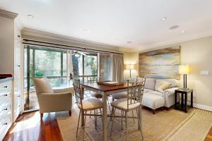 a living room with a table and chairs and a couch at Mariner's Watch 4236 in Kiawah Island