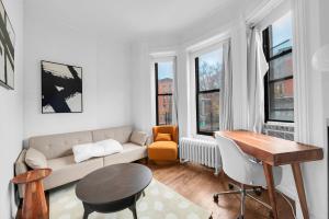 a living room with a couch and a table at Stylish 3Bd Heart of Park Slope in Brooklyn