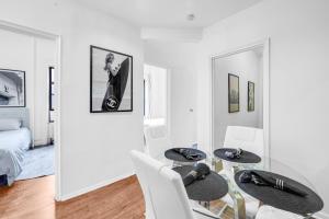 a dining room with a table and two chairs at Stylish 3Bd Heart of Park Slope in Brooklyn