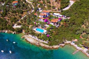 an aerial view of a house on an island in the water at Pounda Paou in Metókhion
