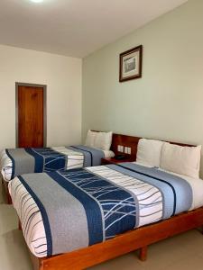 Postel nebo postele na pokoji v ubytování HOTEL POSADA DEL SOL