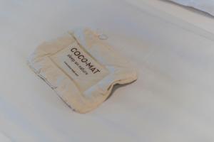 a sock with the word socialism on it sitting on a bed at Pounda Paou in Metókhion