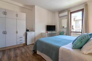 Posteľ alebo postele v izbe v ubytovaní Sardinia Guest House