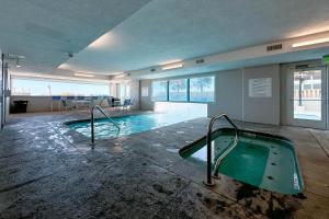 an empty swimming pool in a large building at Island Royale 902 in Gulf Shores