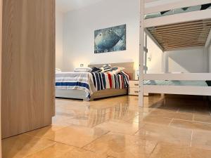 a bedroom with a bunk bed and a ladder at La Casetta del Vicolo in La Spezia