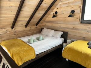 Postel nebo postele na pokoji v ubytování Bungalux Kopaonik