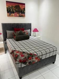 En eller flere senge i et værelse på Manshu Guesthouse