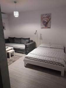Postel nebo postele na pokoji v ubytování Smart Apartman