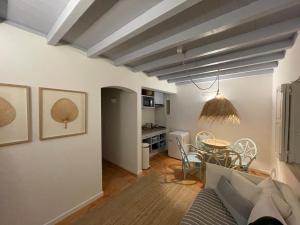a living room with a couch and a table at Herdade d'Amoreira Jasmin Villa in Aljezur