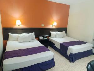 Postel nebo postele na pokoji v ubytování HOTEL ValgrandE