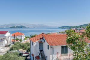 a view of a town with a body of water at Apartments Deepwater in Slatine