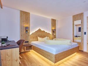 Postel nebo postele na pokoji v ubytování Hotel Alt Vent Tyrol
