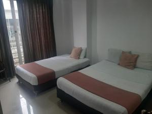 Krevet ili kreveti u jedinici u okviru objekta Hotel Aussie koala