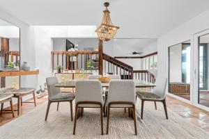 a dining room with a table and chairs at Olive Villa Palmas - Modern Beachfront in Humacao