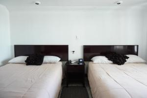 Postel nebo postele na pokoji v ubytování Hotel María Celeste