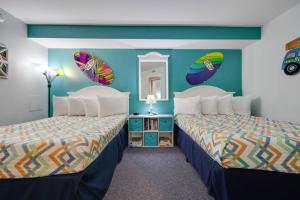 The 7th Heaven in Myrtle Beach客房内的一张或多张床位