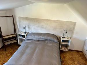 a bedroom with a bed and two night stands at Ph Completo Petfriendly in Mar del Plata