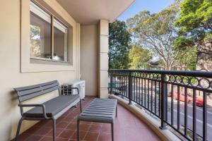 a balcony with a bench and a window at Camperdown Cozy Corner 1 in Sydney