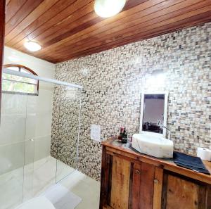 a bathroom with a sink and a shower at Nosso lar na Ferradurinha in Búzios +42 photos