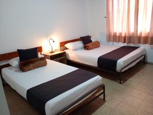 Hotel Alpino Armenia客房内的一张或多张床位