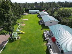 an aerial view of a group of buildings and a yard at Stanhope Cottages in Stanhope