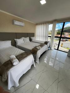 Postel nebo postele na pokoji v ubytování Hotel Aris