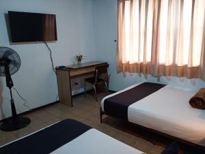 Hotel Alpino Armenia客房内的一张或多张床位