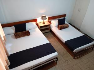 Hotel Alpino Armenia客房内的一张或多张床位
