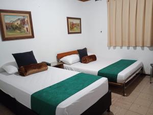 Hotel Alpino Armenia客房内的一张或多张床位