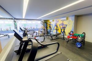 a gym with treadmills and machines in a room at Eco Summer Tambaú WB Genius Flats in João Pessoa