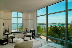 a bedroom with a view of the water at Gaylord National Resort & Convention Center in National Harbor