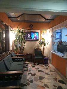 TV a/nebo společenská místnost v ubytování Hotel Manhattan City + 26 fotografií