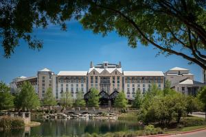 a large building with a pond in front of it at Gaylord Texan Resort and Convention Center in Grapevine