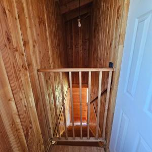 an overhead view of a wooden staircase in a room at Cabañas Los Arrayanes in Licán Ray