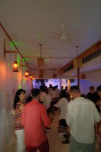 a group of people standing in a room at Faana Inn in Fulhadhoo