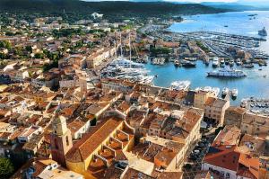 an aerial view of a harbor with boats in the water at Fortuna Residence in Saint-Tropez