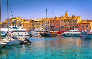 a group of boats docked in a harbor with buildings at Fortuna Residence in Saint-Tropez +97 photos