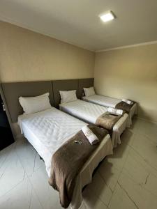 Postel nebo postele na pokoji v ubytování Hotel Aris