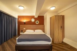 Postel nebo postele na pokoji v ubytování Blok M Residence