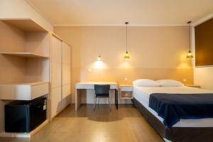 Postel nebo postele na pokoji v ubytování Blok M Residence