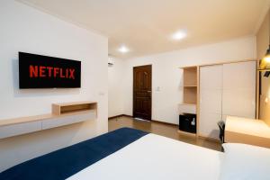 Postel nebo postele na pokoji v ubytování Blok M Residence